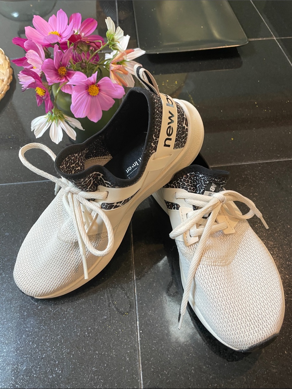 New Balance Nergize Sport White Sneakers with leopard trim.
